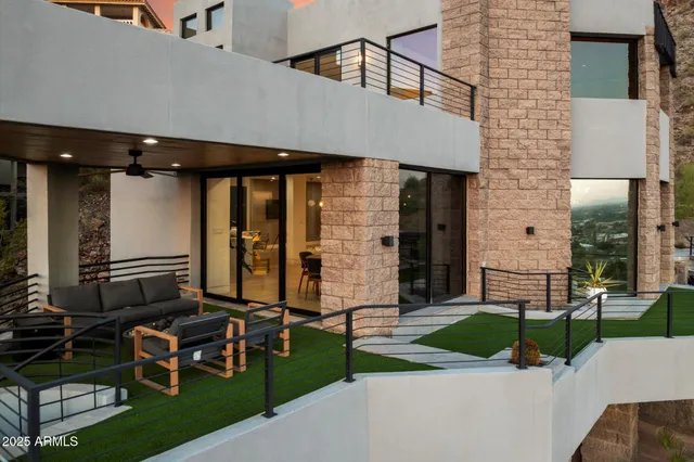 an aerial view of a house with a yard