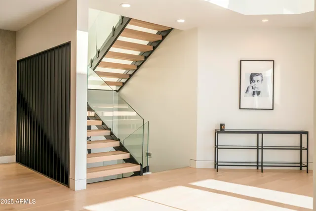 a view of a chairs and table in patio with a lake view