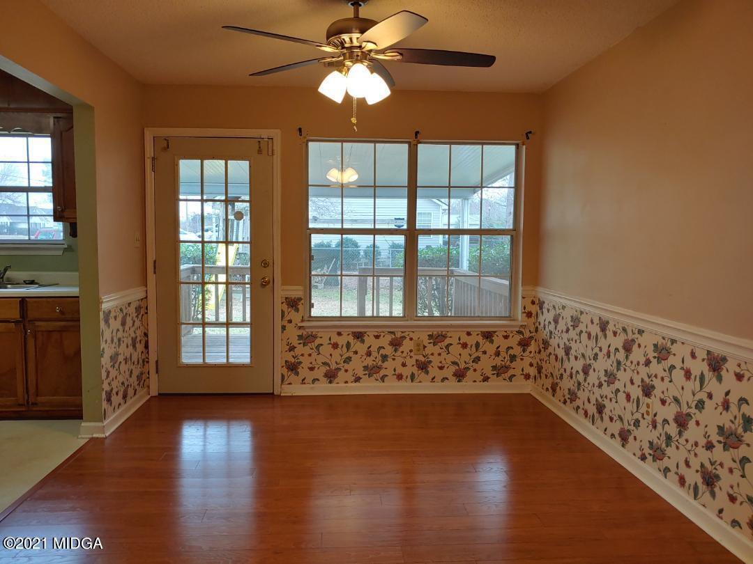 6210 Skipperton Road Macon, GA 31216 - Photo 12 of 15 a view of wooden floor and windows in an empty room