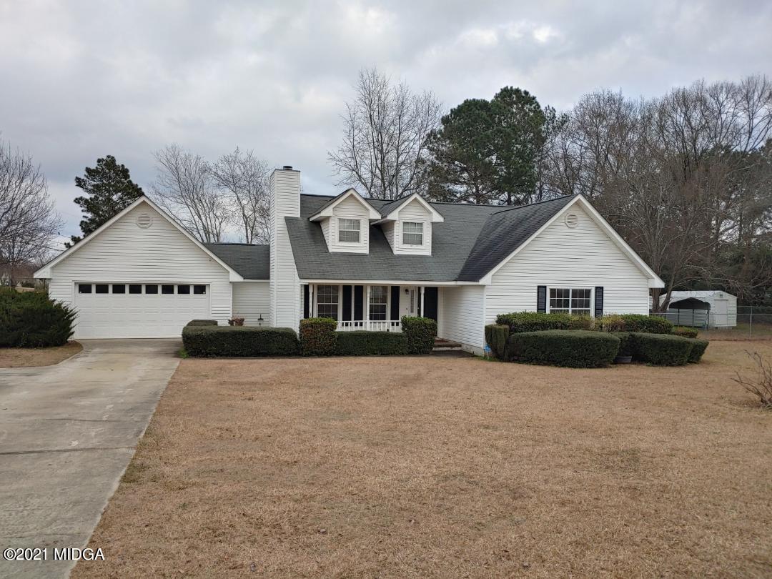 6210 Skipperton Road Macon, GA 31216 - Photo 3 of 15 a front view of a house with a yard and garage