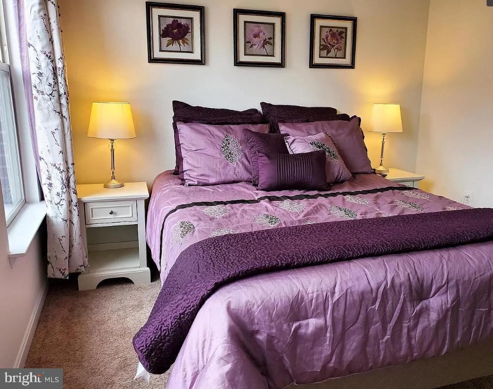 10 South Exeter Street Baltimore, MD 21202 - Photo 4 of 8 Serene purple-hued bedroom retreat.
