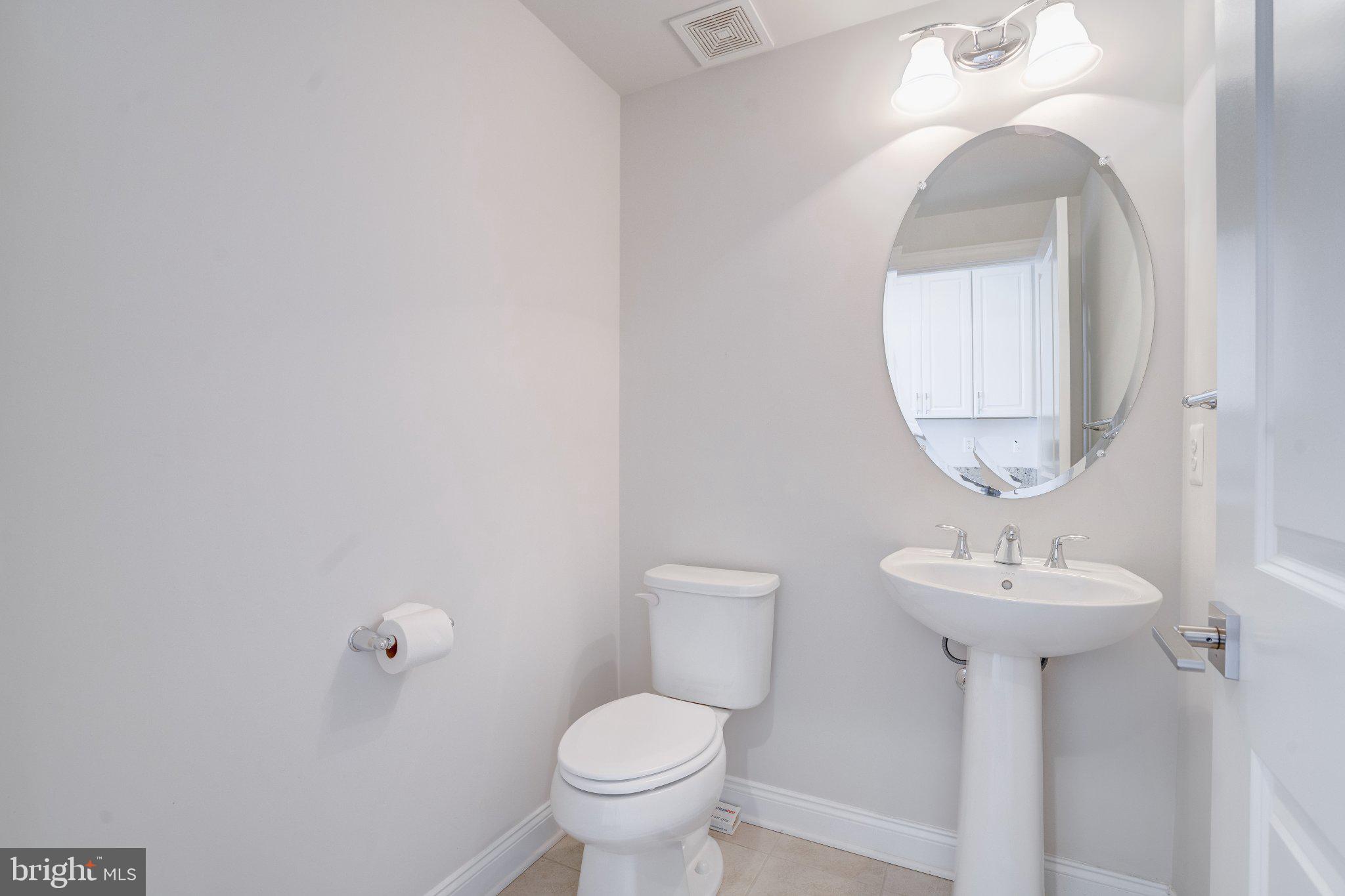 2517 Cherry Tree Road Hanover, MD 21076 - Photo 37 of 61 Sleek and modern powder room design.