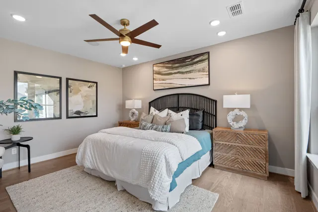 a bedroom with a large bed and a window