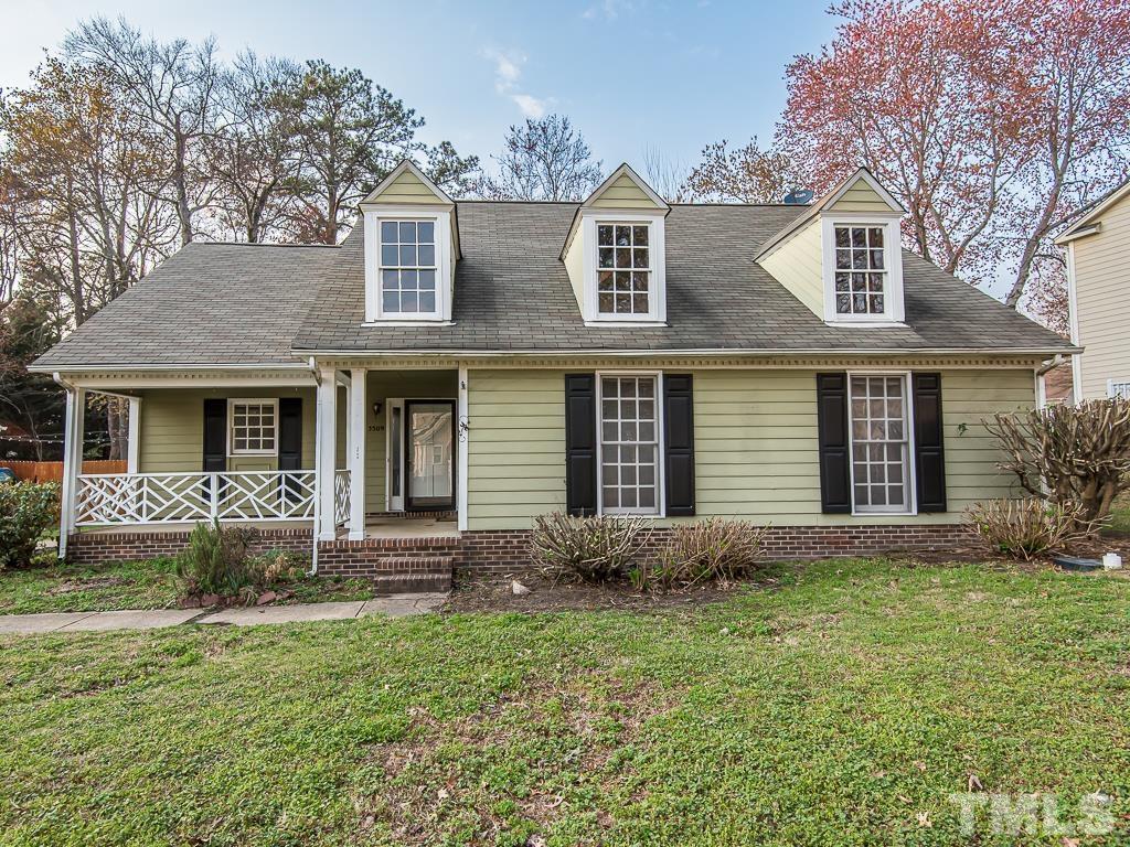 3509 Wickersham Way Raleigh, NC 27604 - Photo 1 of 24 front view of a house with a yard