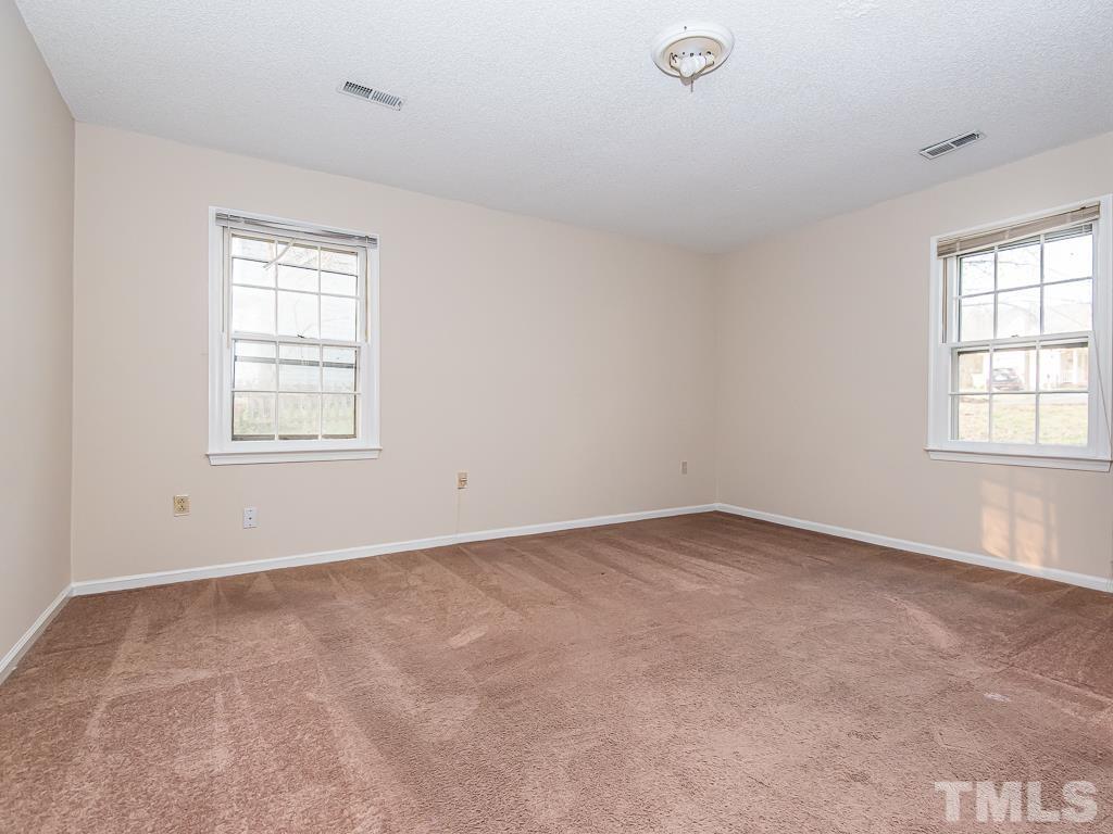 3509 Wickersham Way Raleigh, NC 27604 - Photo 12 of 24 an empty room with windows