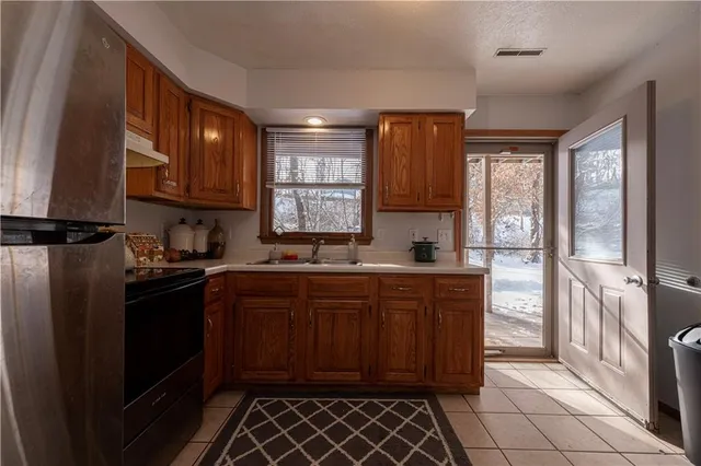a living room with furniture a window and a fireplace