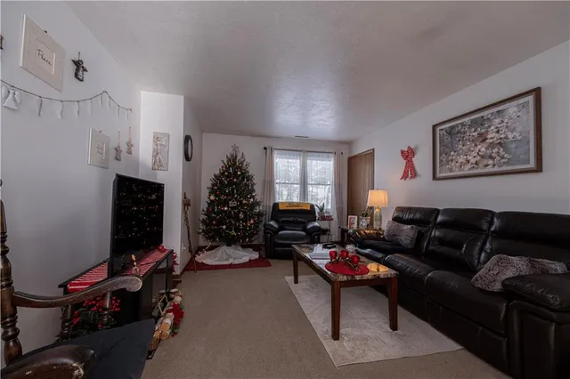 a bedroom with a bed and a potted plant