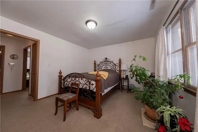a kitchen with a sink a refrigerator and cabinets