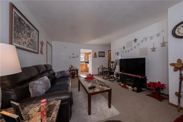 a bedroom with a bed and a potted plant
