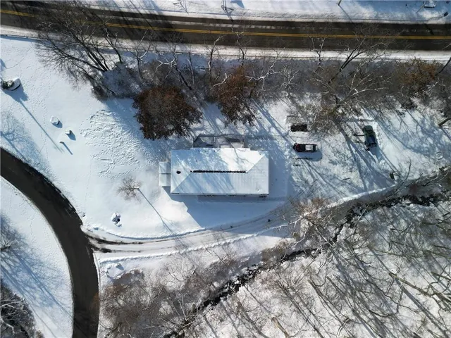 a bedroom with bed and cabinets