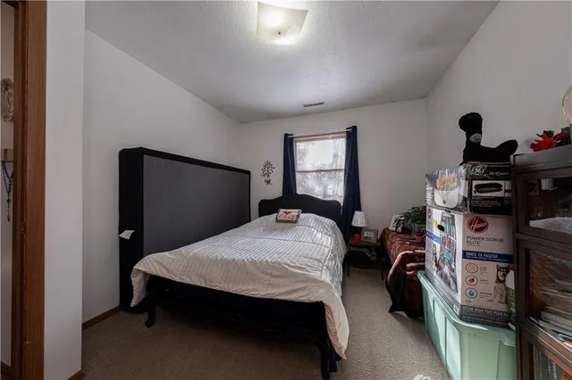 a table with wine bottles and sink on it
