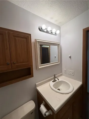 a view of a chairs and table in the balcony