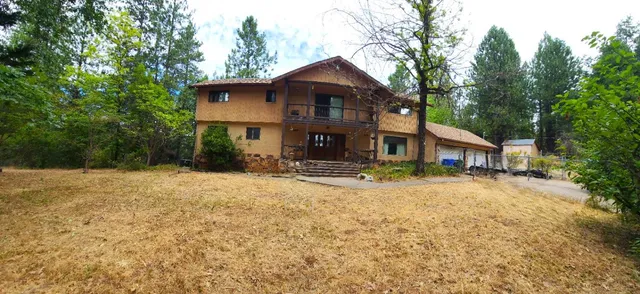a front view of house with outdoor space