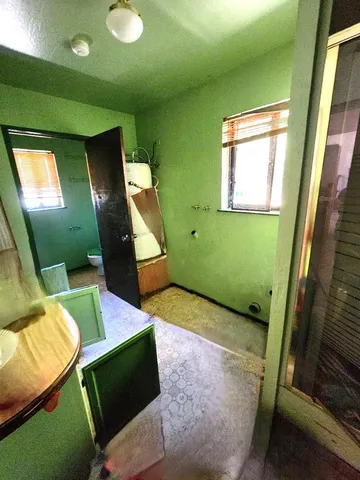 a view of a backyard of the house