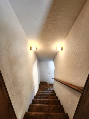 a view of a house with a snow in the yard