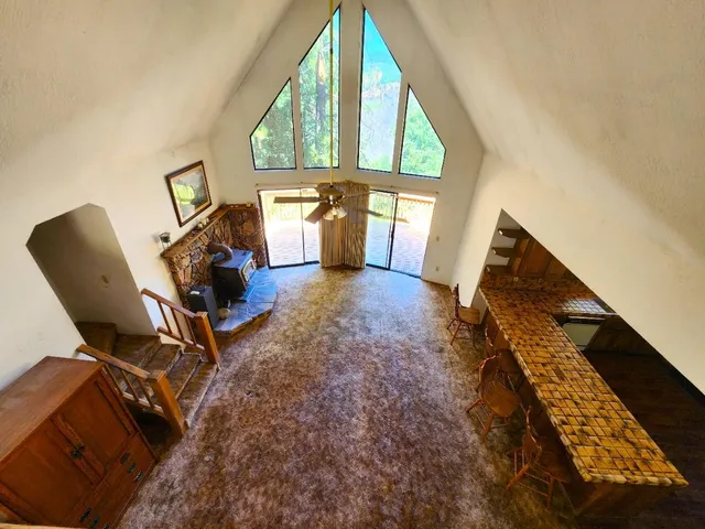 a view of a backyard with a tree