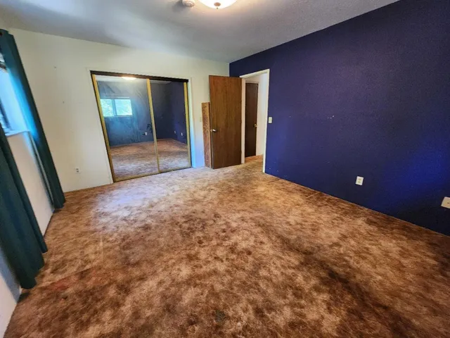 a view of a backyard of the house