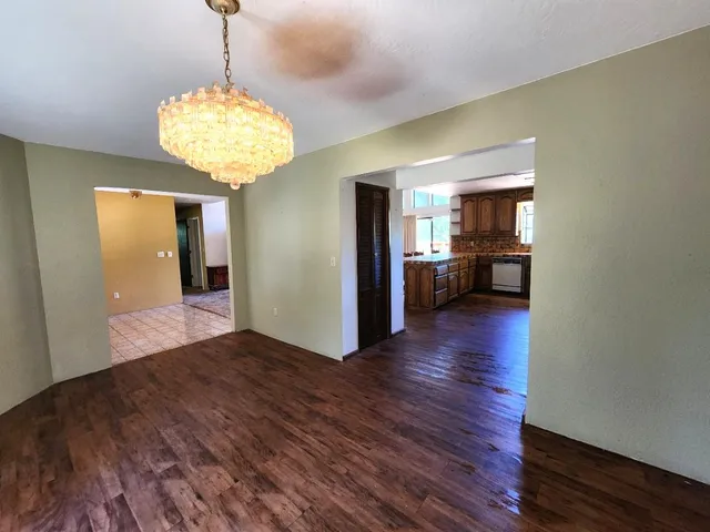 a view of living room with furniture and a flat screen tv