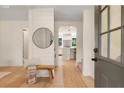 a view of a livingroom with furniture wooden floor and window