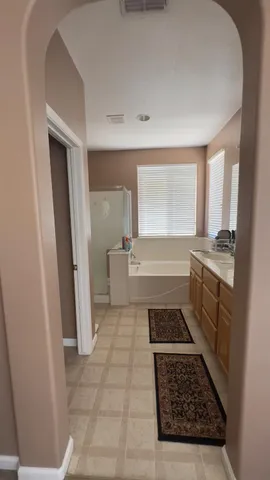 a kitchen with sink stove and cabinets