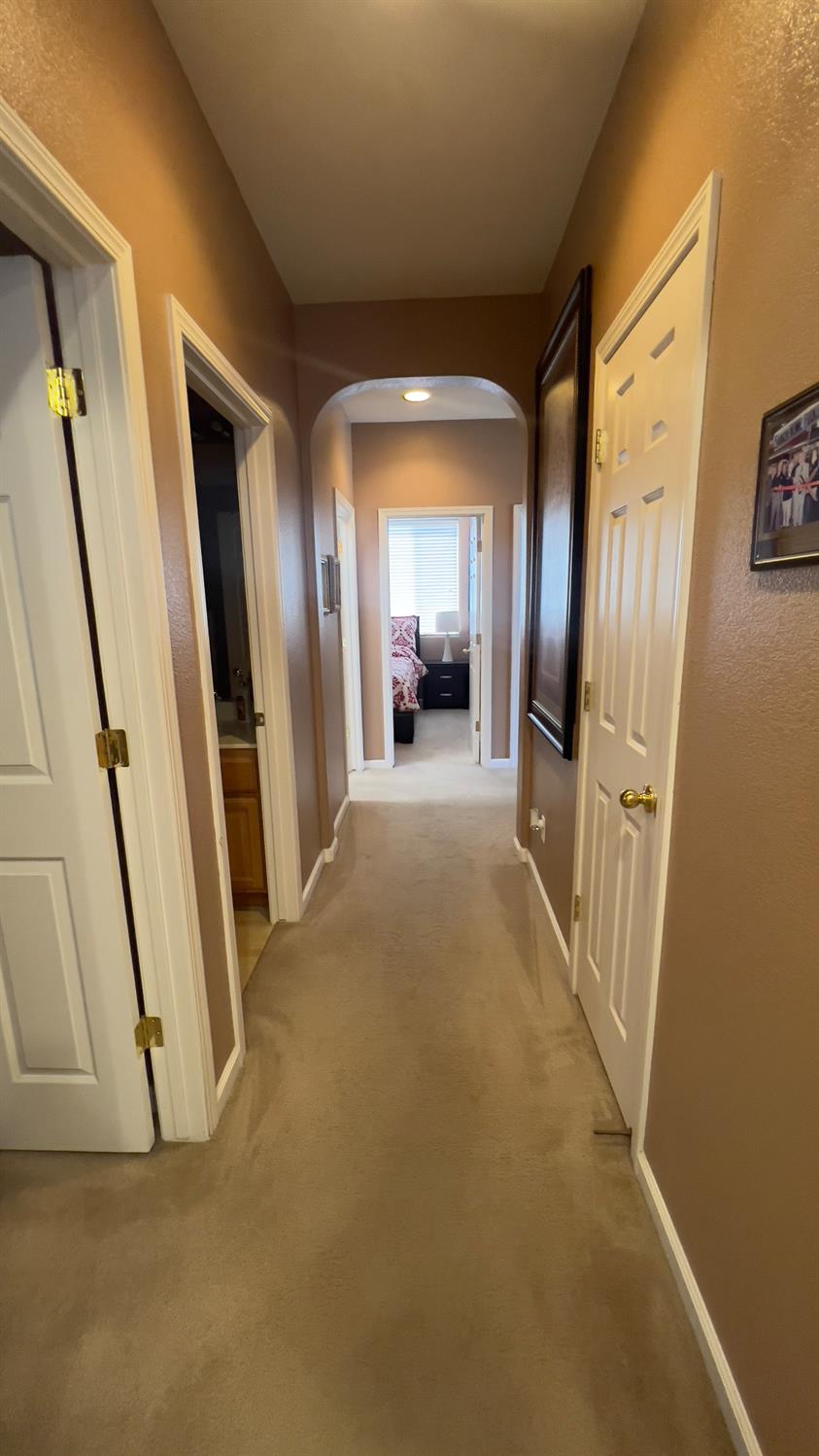 5221 East Byrd Avenue Fresno, CA 93725 - Photo 5 of 15 a view of a hallway with wooden floor