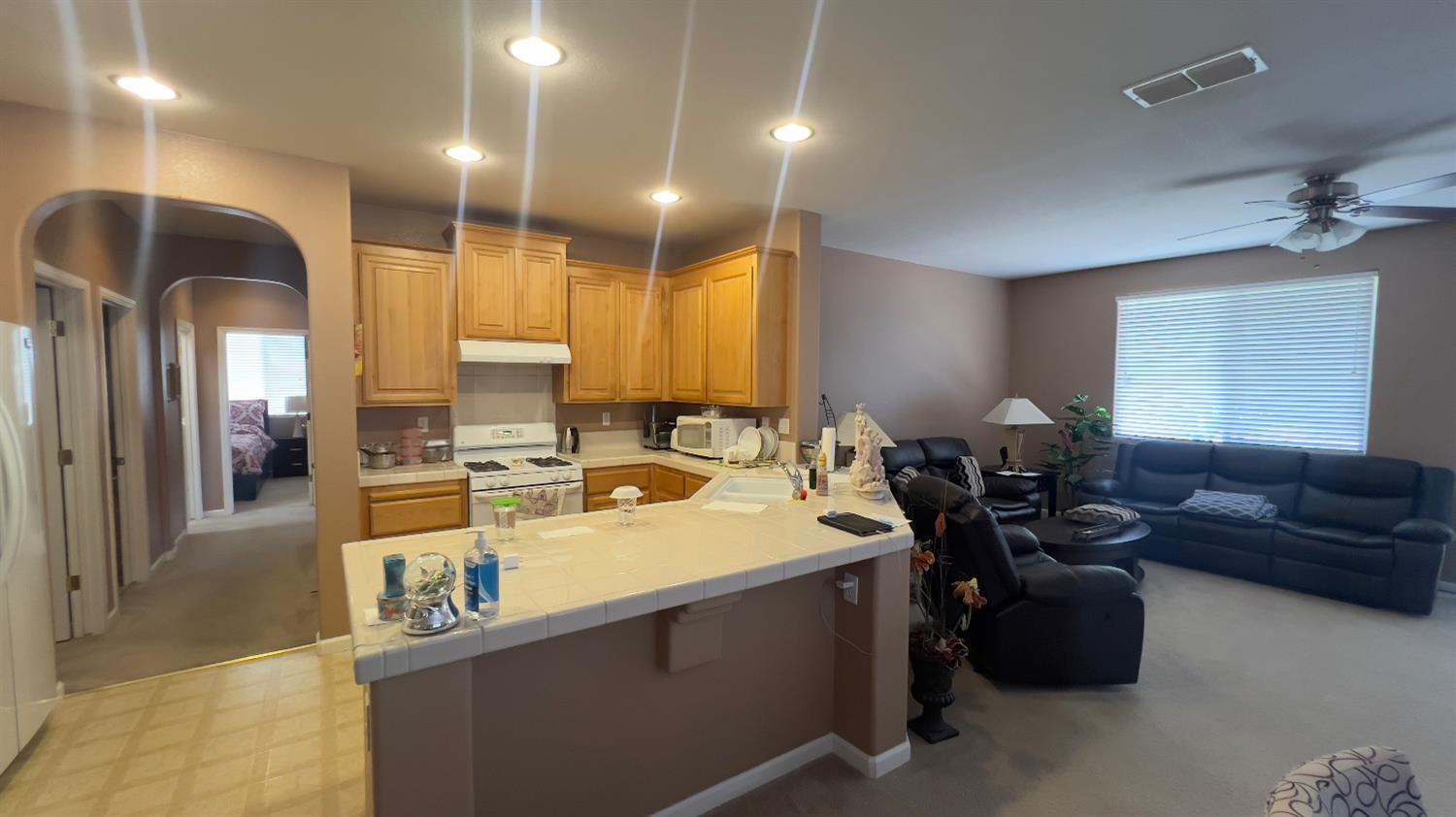 5221 East Byrd Avenue Fresno, CA 93725 - Photo 7 of 15 a living room with furniture stove and a window