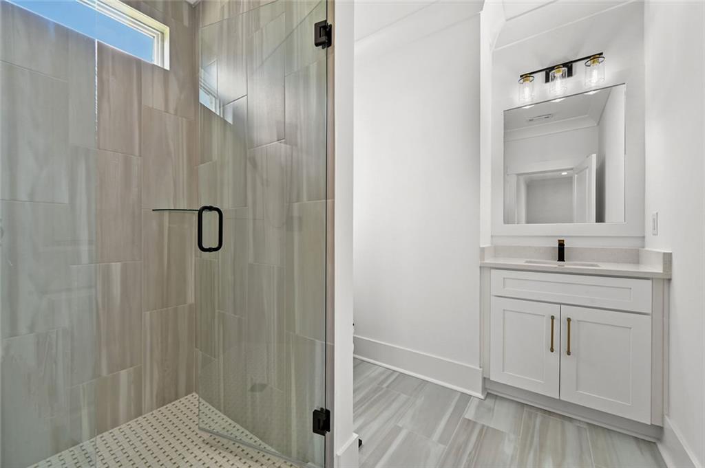 2694 Thompson Mill Road Buford, GA 30519 - Photo 64 of 70 a bathroom with a sink and mirror