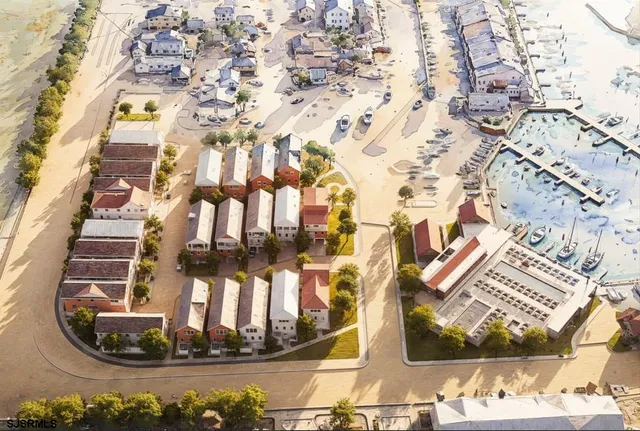 an aerial view of a residential building with an outdoor space