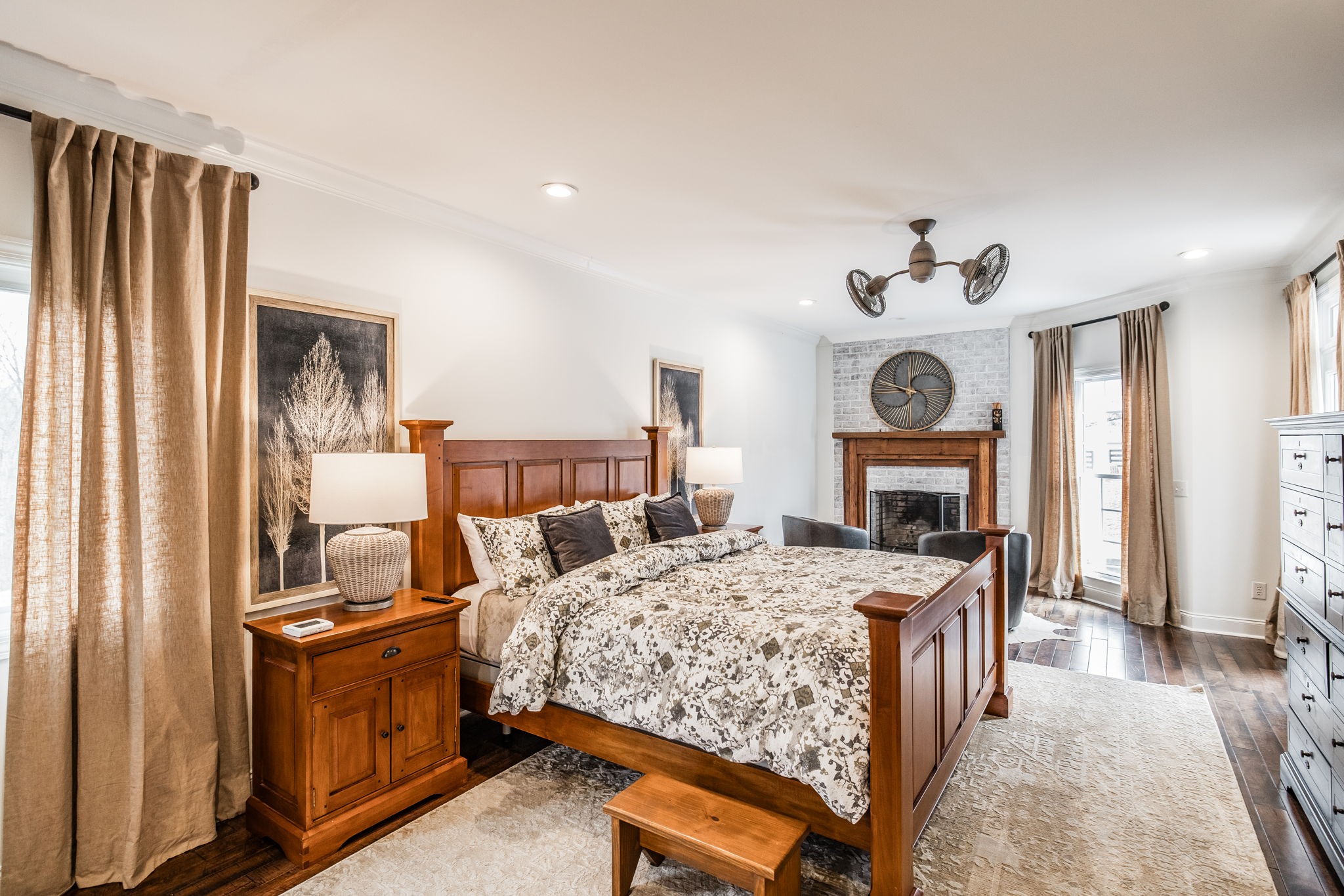 8137 Shoals Branch Road Primm Springs, TN 38476 - Photo 16 of 69 a bedroom with a bed and a chandelier