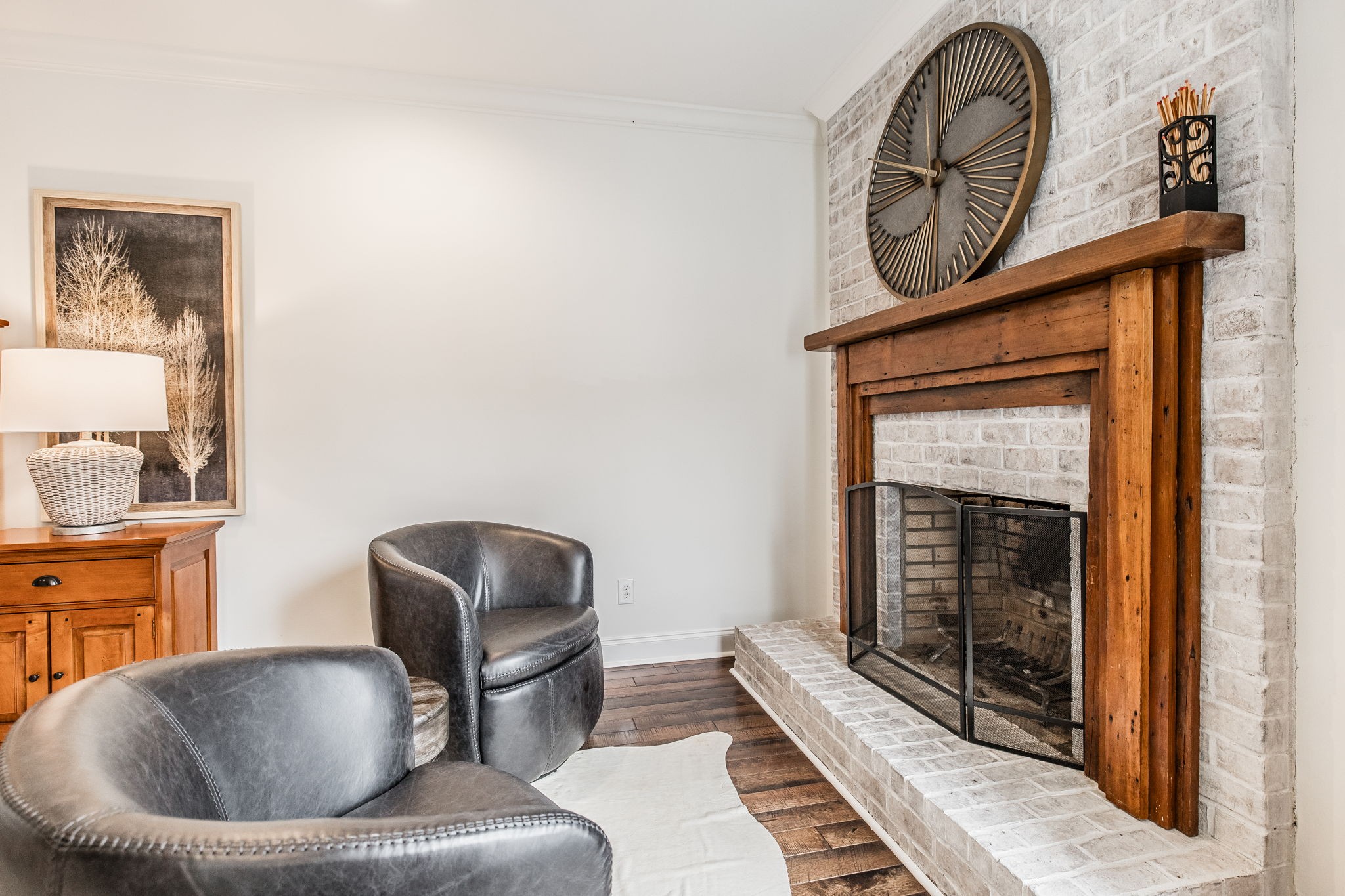 8137 Shoals Branch Road Primm Springs, TN 38476 - Photo 18 of 69 a living room with furniture and a fireplace