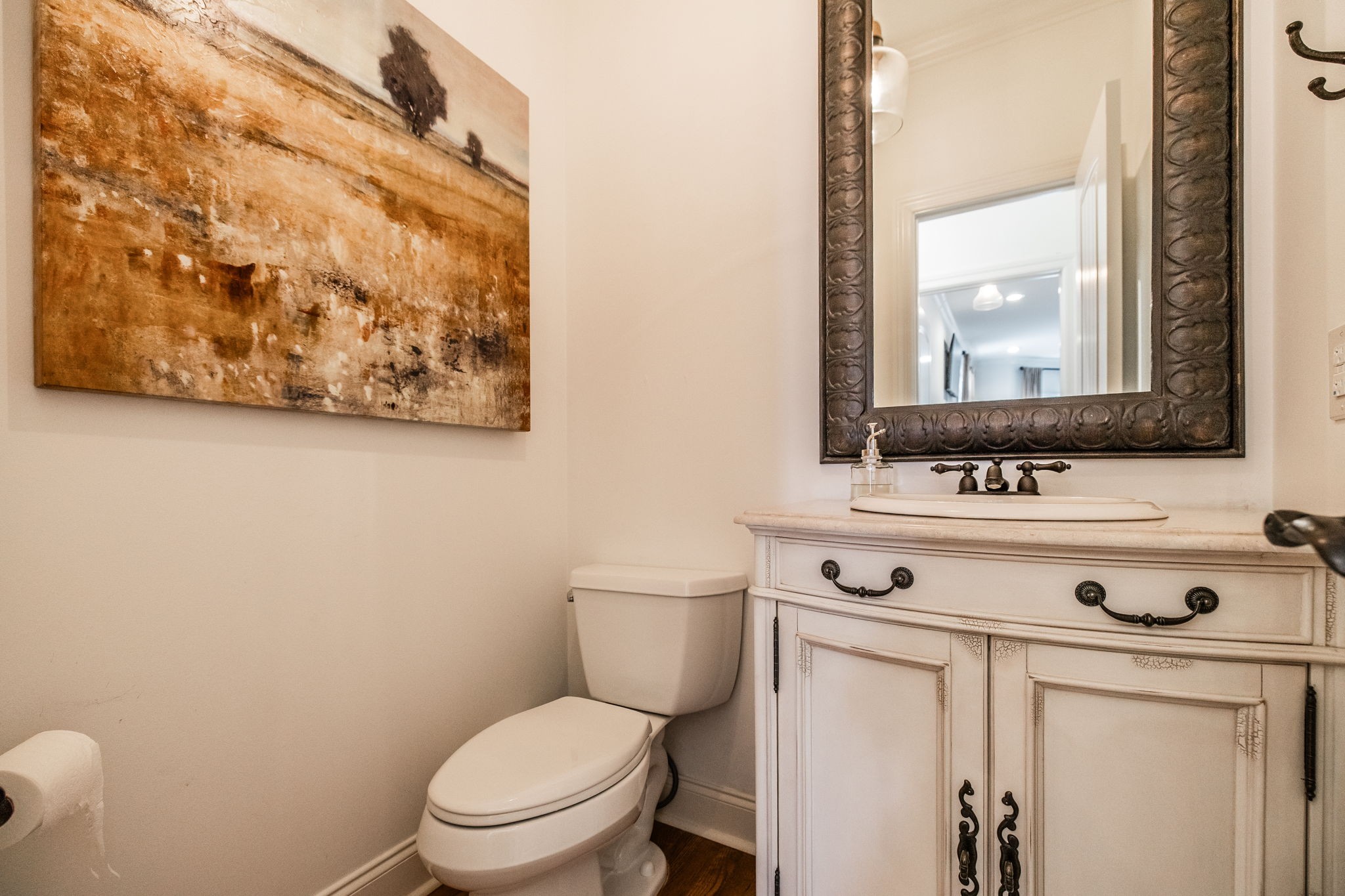 8137 Shoals Branch Road Primm Springs, TN 38476 - Photo 25 of 69 a bathroom with a toilet sink and mirror