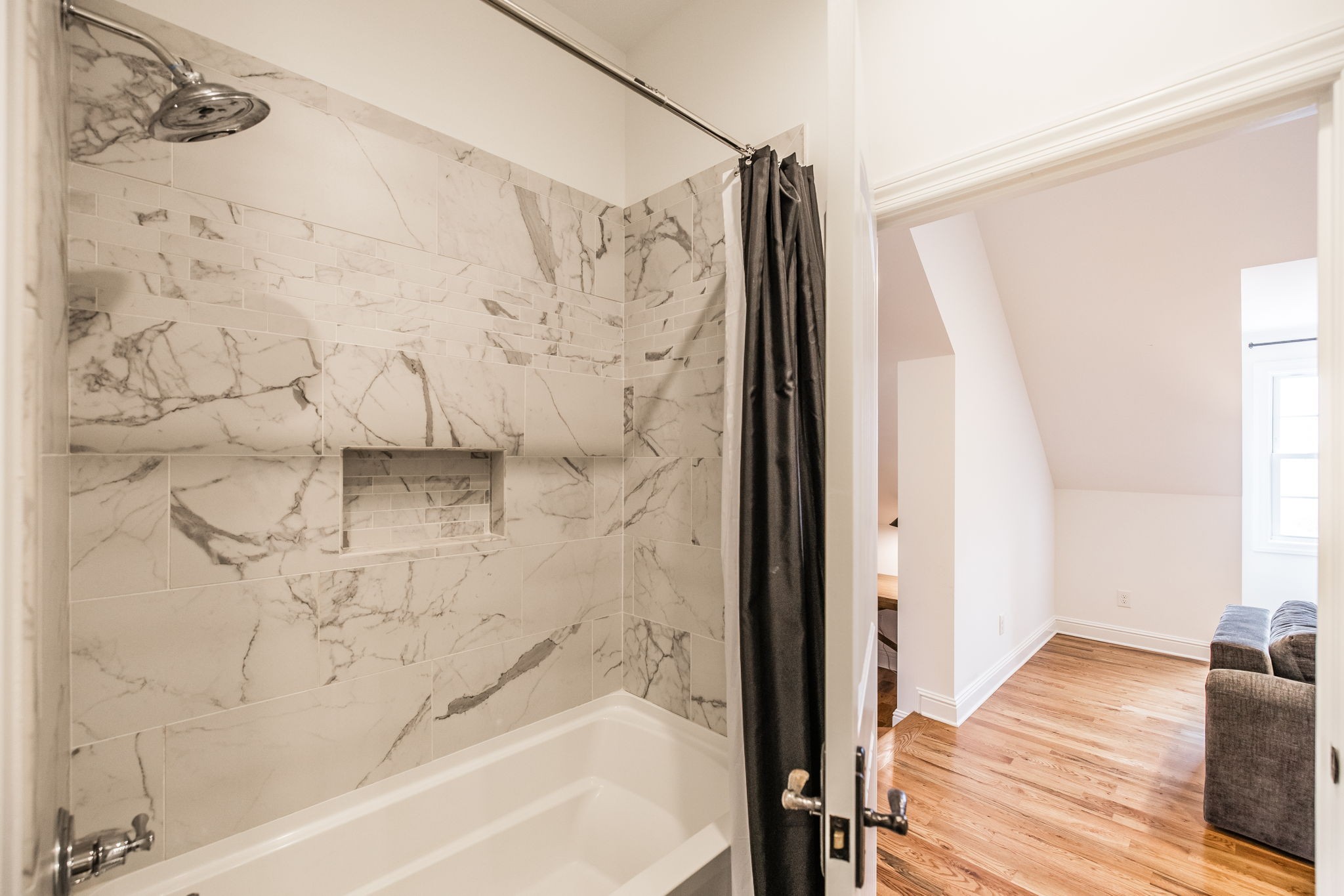 8137 Shoals Branch Road Primm Springs, TN 38476 - Photo 35 of 69 a bathroom with a bathtub and shower