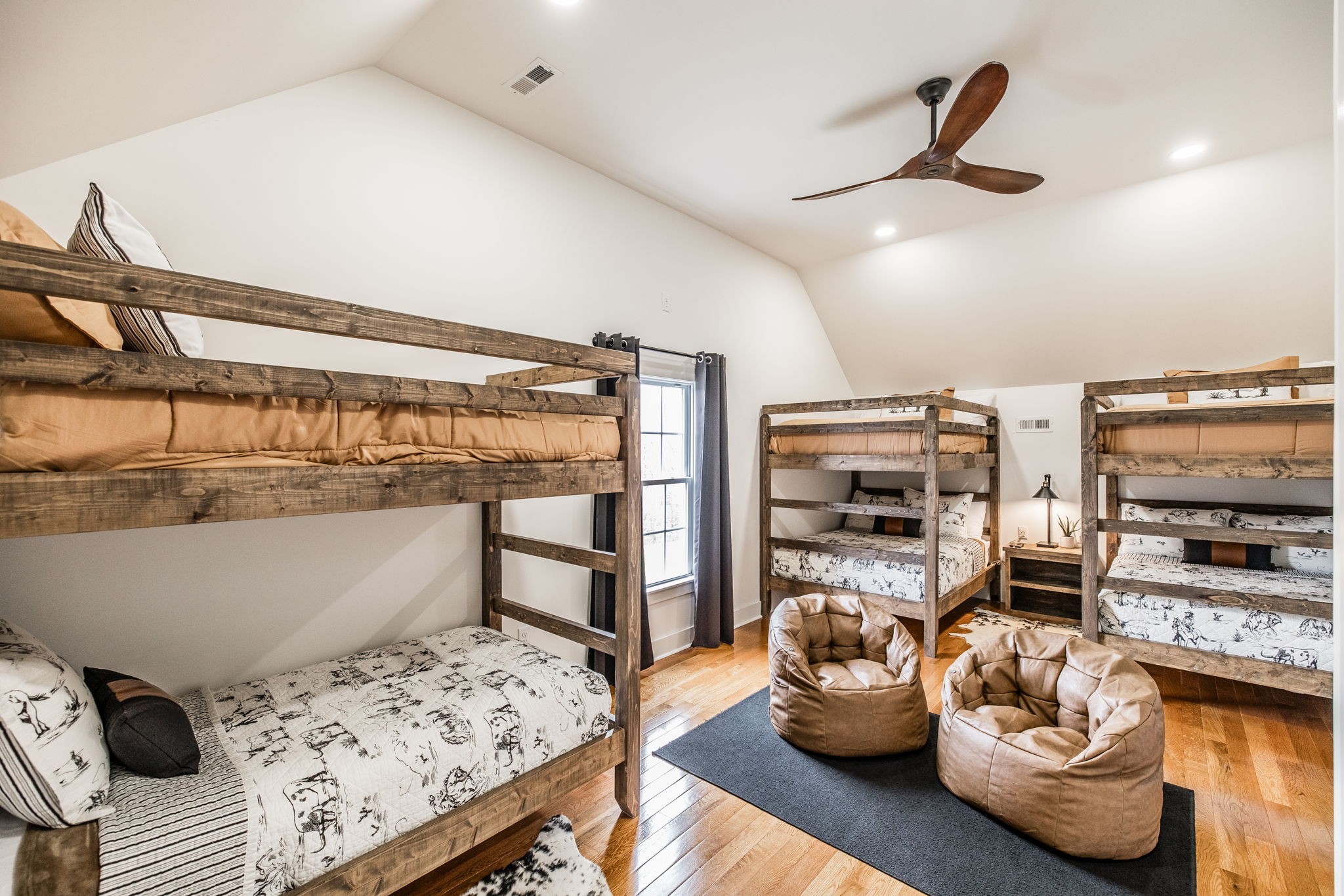 8137 Shoals Branch Road Primm Springs, TN 38476 - Photo 36 of 69 a bedroom with furniture and a wooden floor