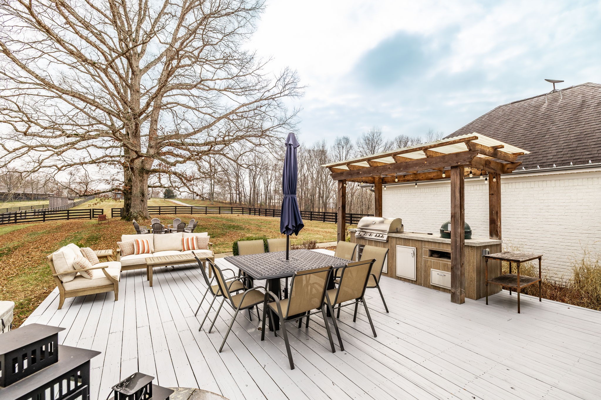 8137 Shoals Branch Road Primm Springs, TN 38476 - Photo 41 of 69 a view of a patio with wooden floor table and chairs