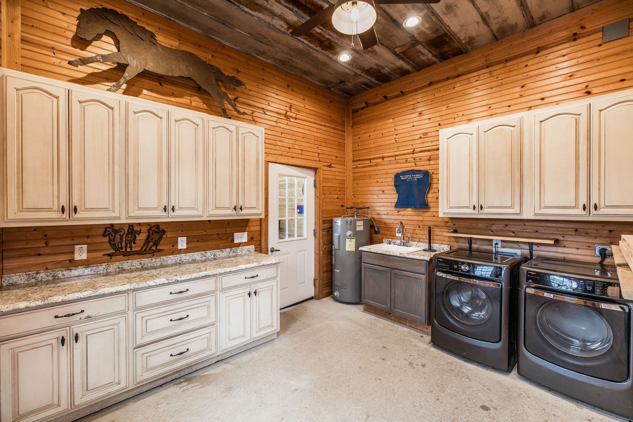 8137 Shoals Branch Road Primm Springs, TN 38476 - Photo 61 of 69 a kitchen with stainless steel appliances granite countertop a stove sink and cabinets