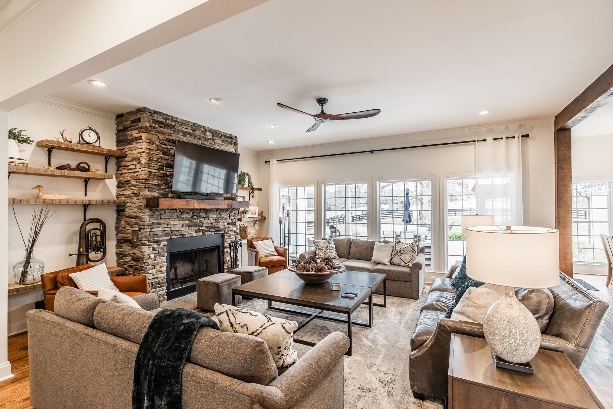 8137 Shoals Branch Road Primm Springs, TN 38476 - Photo 7 of 69 a living room with furniture fireplace and a large window