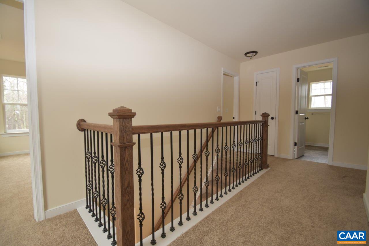 459 Lake Road, Unit HL12B Troy, VA 22974 - Photo 11 of 22 a view of a hallway with wooden floor and stairs