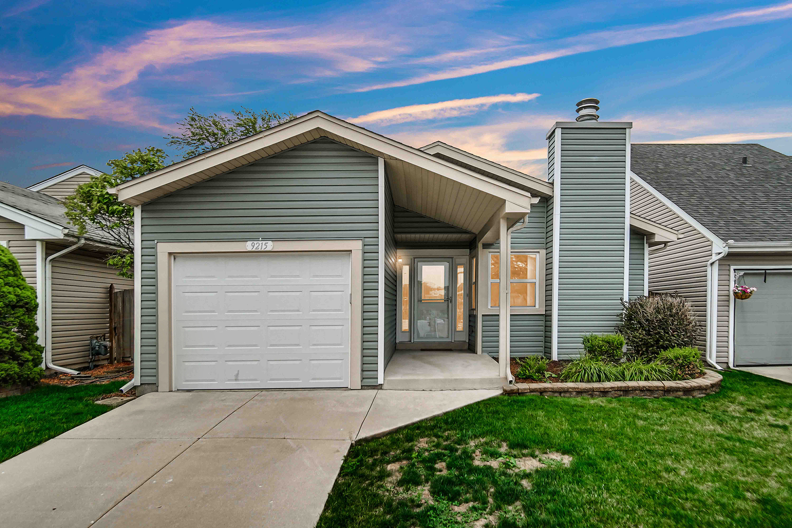 9215 Fox Court Orland Hills, IL 60487 - Photo 1 of 21 a front view of a house with a garden and plants
