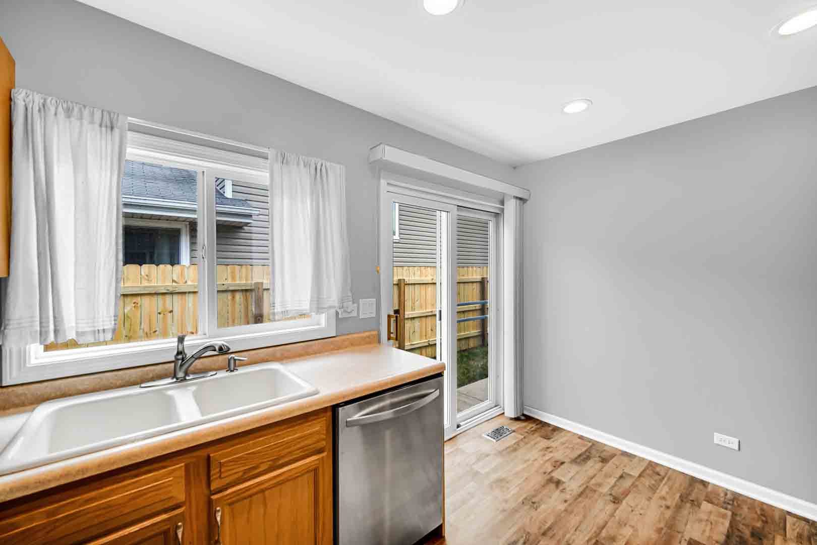 9215 Fox Court Orland Hills, IL 60487 - Photo 13 of 21 a kitchen with a sink and a window