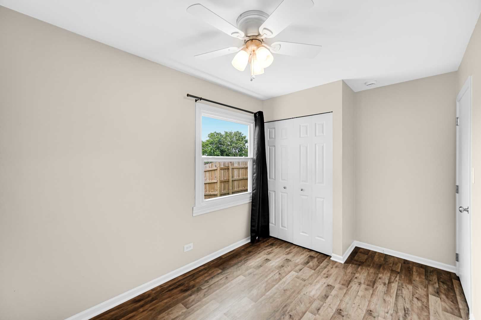 9215 Fox Court Orland Hills, IL 60487 - Photo 18 of 21 an empty room with a window and a fan