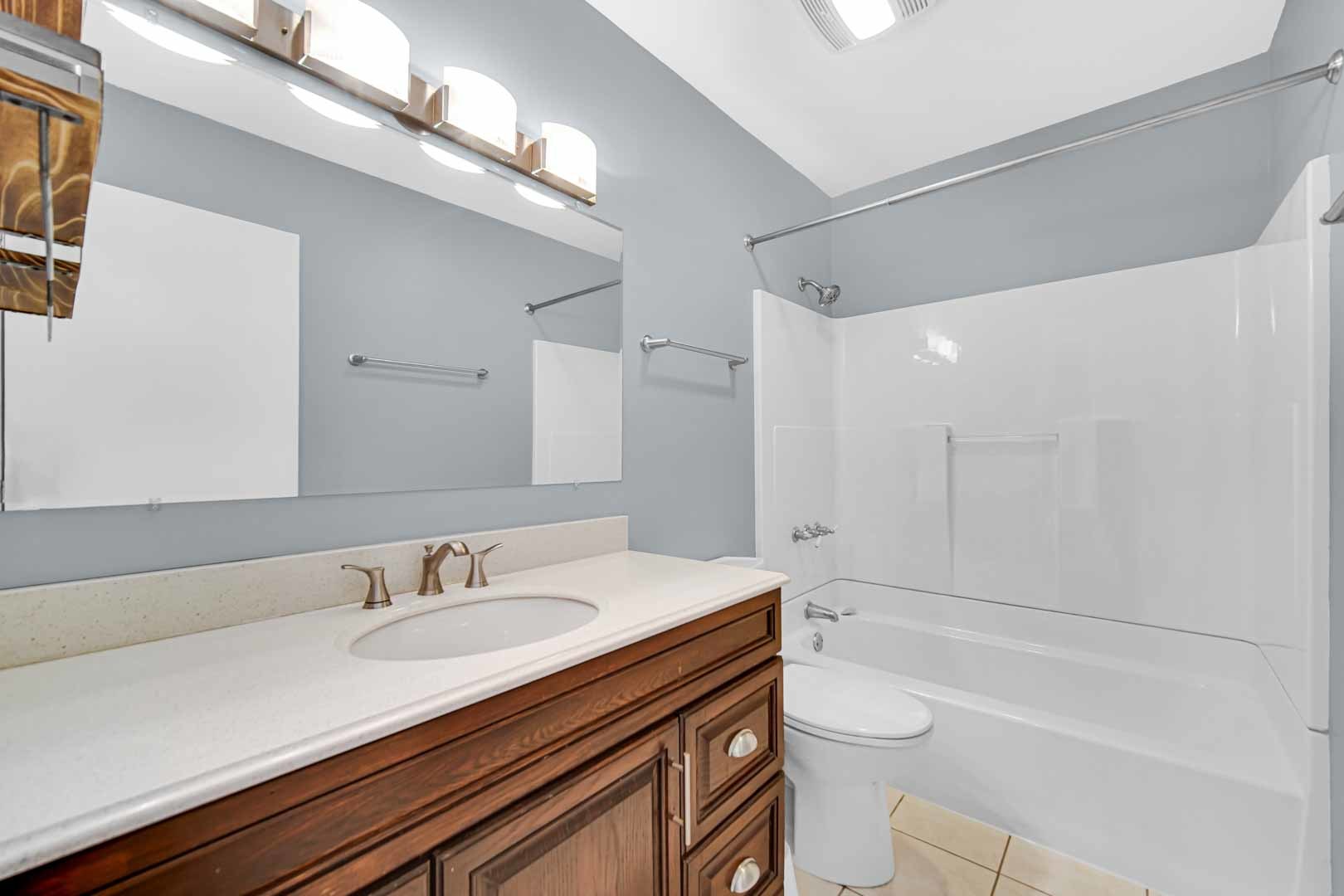 9215 Fox Court Orland Hills, IL 60487 - Photo 19 of 21 a bathroom with a granite countertop sink a toilet a mirror and shower