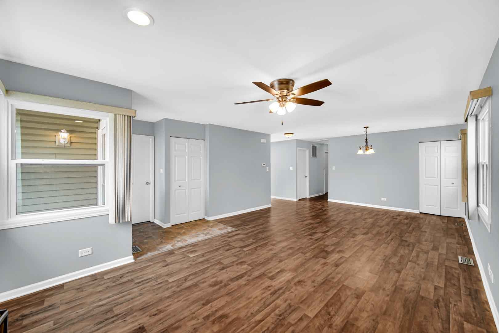9215 Fox Court Orland Hills, IL 60487 - Photo 7 of 21 a view of empty room with wooden floor and fan