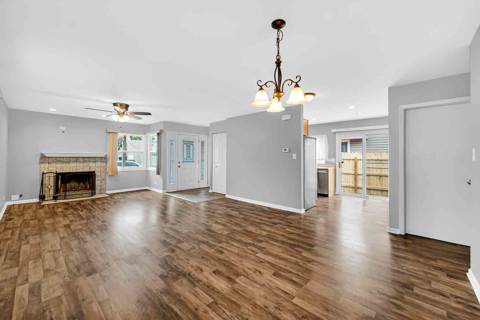 9215 Fox Court Orland Hills, IL 60487 - Photo 9 of 21 a view of a livingroom with wooden floor and a fireplace