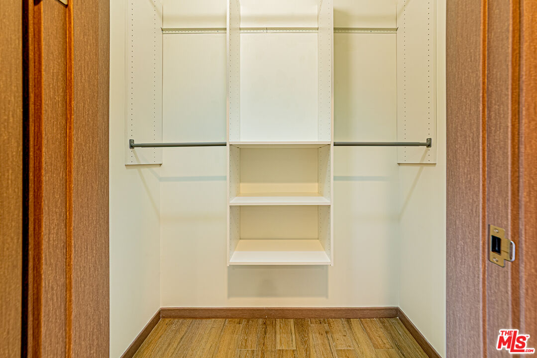 903 South New Hampshire Avenue, Unit 303 Los Angeles, CA 90006 - Photo 14 of 33 a view of walk in closet with empty racks
