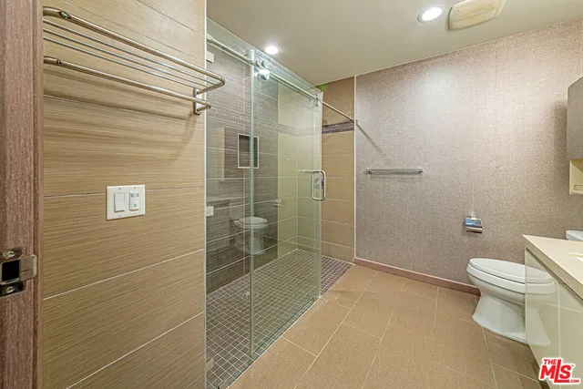 an empty room with wooden floor and a window