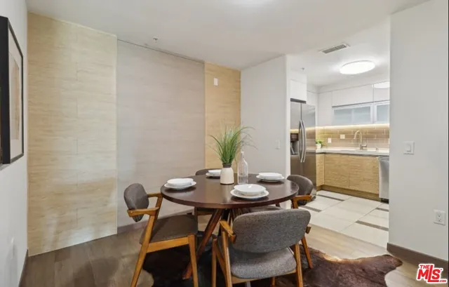 a kitchen with a stove a sink and a refrigerator