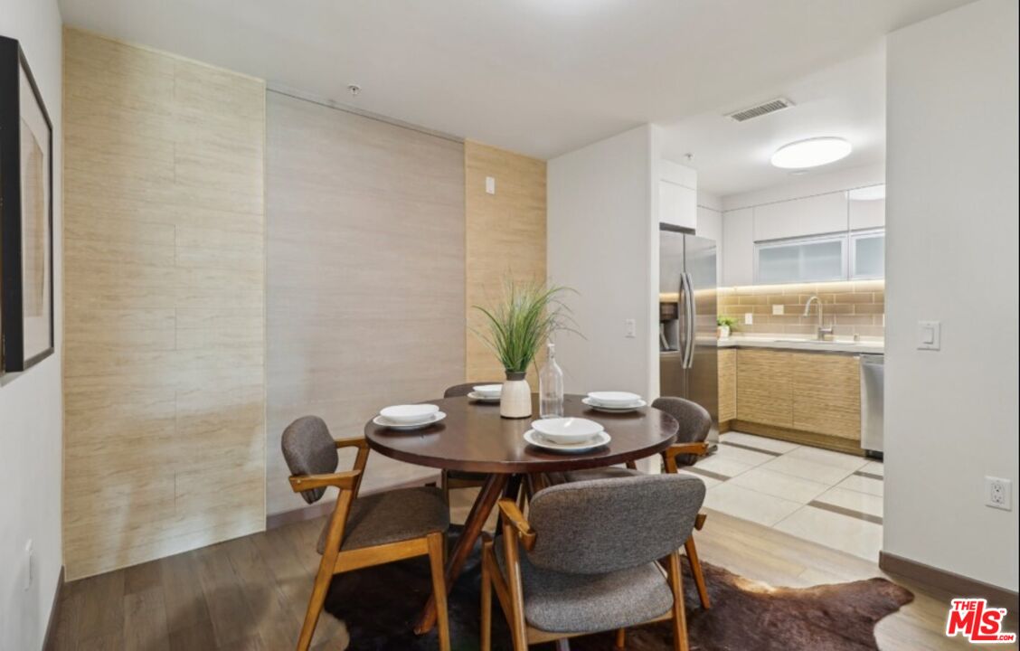 903 South New Hampshire Avenue, Unit 303 Los Angeles, CA 90006 - Photo 5 of 33 a view of a dining room with furniture