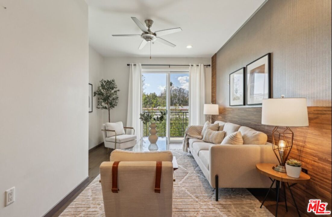 903 South New Hampshire Avenue, Unit 303 Los Angeles, CA 90006 - Photo 7 of 33 a living room with furniture and a large window