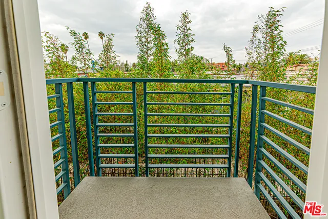 a view of a street view from a balcony