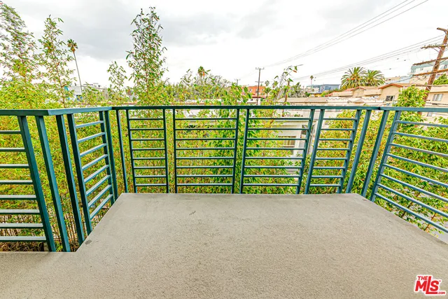 a view of a balcony with city view